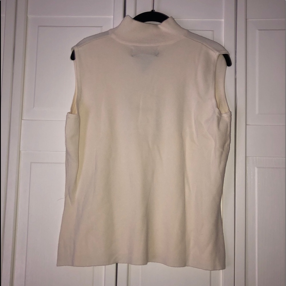 White sleeveless turtleneck